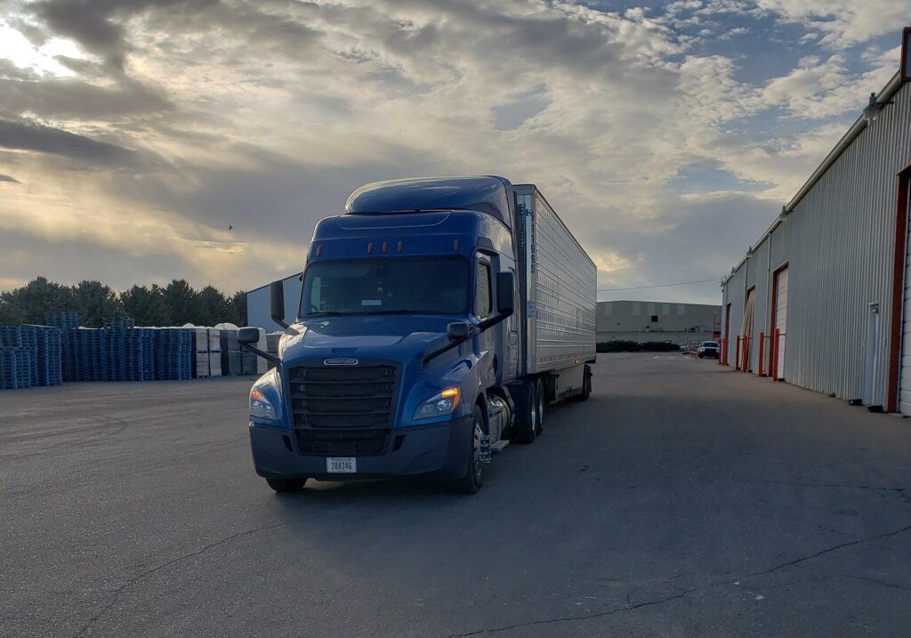 K&B truck sitting by loading dock in the evening